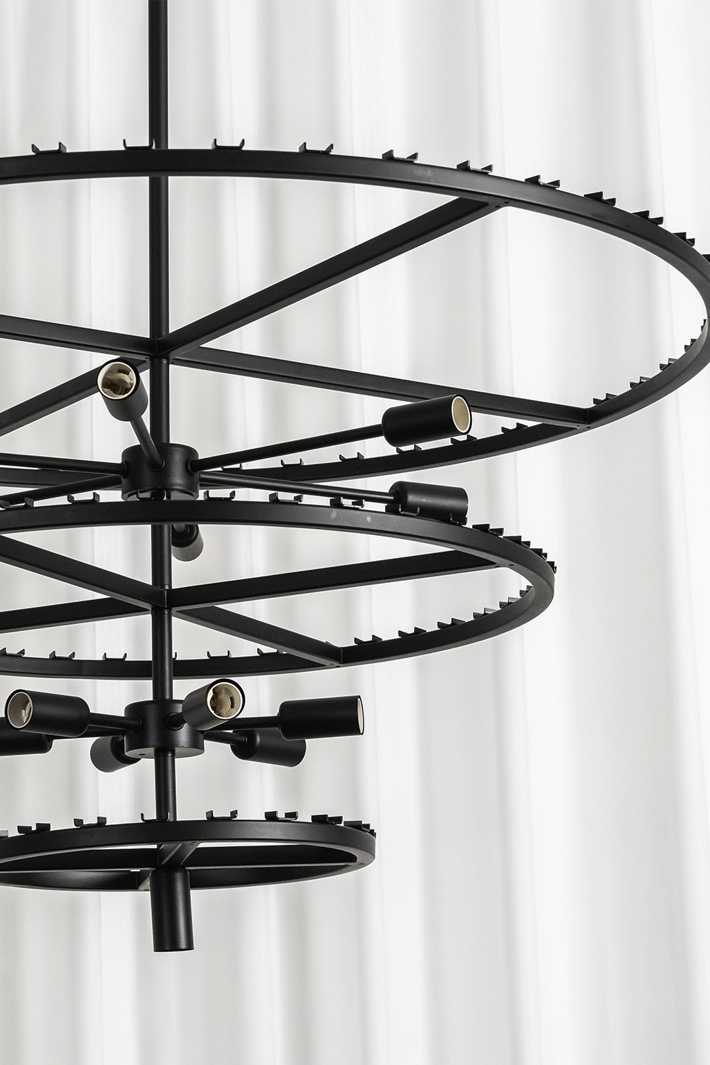 Aven Tiered Glass Prism Chandelier | Glass, Metal | Direct view of the empty multi-tiered concentric black metal frame structure before glass link installation | Detail shot | vexa lamps