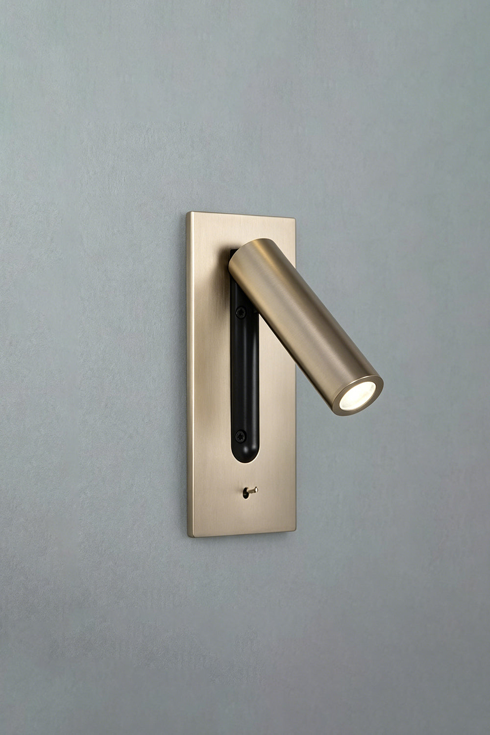 Axial Pivot Folding LED Wall Lamp mounted on a wall, featuring a brushed metal backplate and a sleek adjustable spotlight.