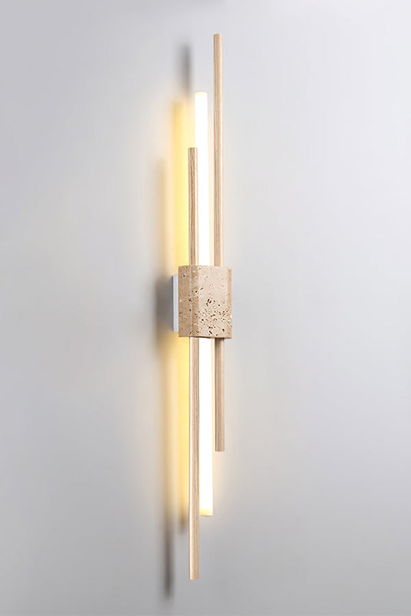 Detailed close-up of Axis Terra wall light | Travertine, Metal, Glass | Showing the lit glass tubes and stone texture | vexa lamps