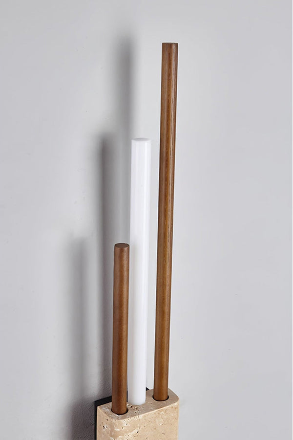 Detailed close-up of Axis Terra wall light | Travertine, Metal, Glass | Showing the lit glass tubes and stone texture | vexa lamps