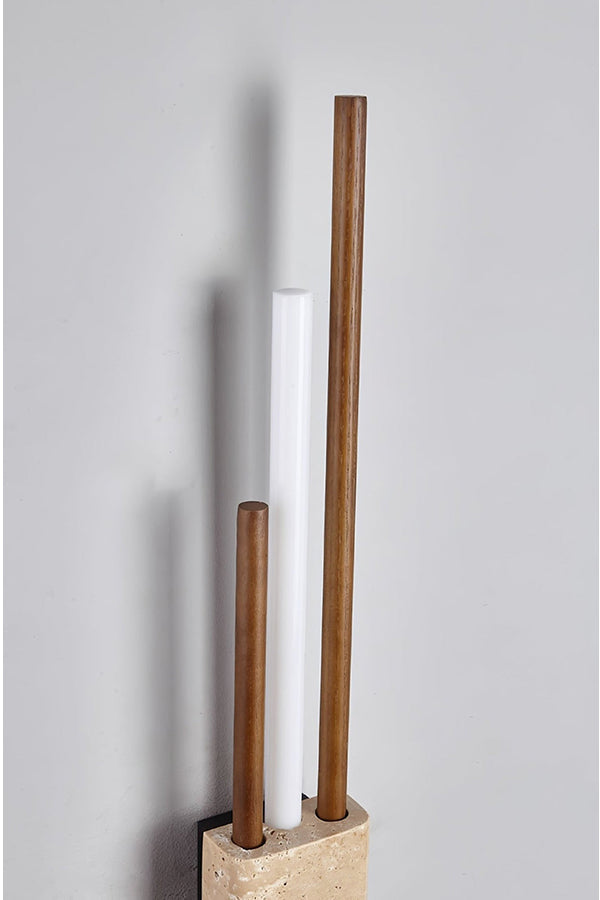 Detailed close-up of Axis Terra wall light | Travertine, Metal, Glass | Showing the lit glass tubes and stone texture | vexa lamps