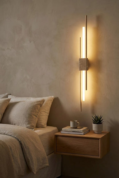 Axis Terra wall light over a wooden nightstand | Travertine, Metal, Glass | Minimalist bedroom interior scene | vexa lamps