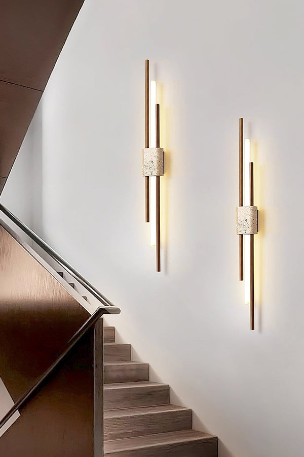 Pair of vertical Axis Terra lights near stairs | Travertine, Metal, Glass | Bright interior lighting on white wall | vexa lamps