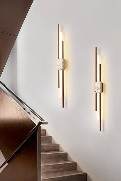 Pair of vertical Axis Terra lights near stairs | Travertine, Metal, Glass | Bright interior lighting on white wall | vexa lamps