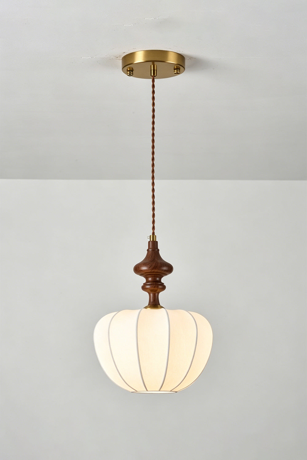 Baird Mid-Century Silk Pendant Light featuring a pumpkin-shaped silk shade and walnut-toned wooden spindle.