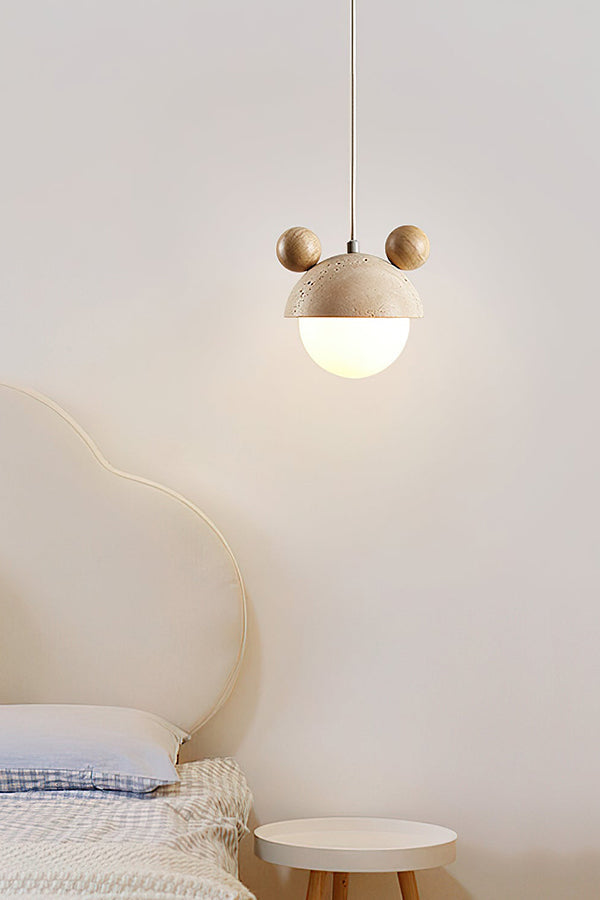 Bear ear stone pendant lamp in a serene bedroom | Travertine, Metal, Glass | Hanging near a cream headboard | vexa lamps