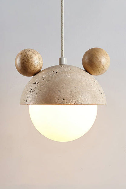 Lit bear ear travertine pendant with light wood ears | Travertine, Metal, Glass | Detailed front shot of the lit globe | vexa lamps
