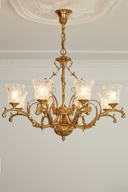 Beatrix Acanthus Leaf Chandelier | Ornate Brass and Frosted Carved Glass | Symmetrical view of the fully illuminated gold chandelier hanging from an ornate ceiling medallion | vexa lamps