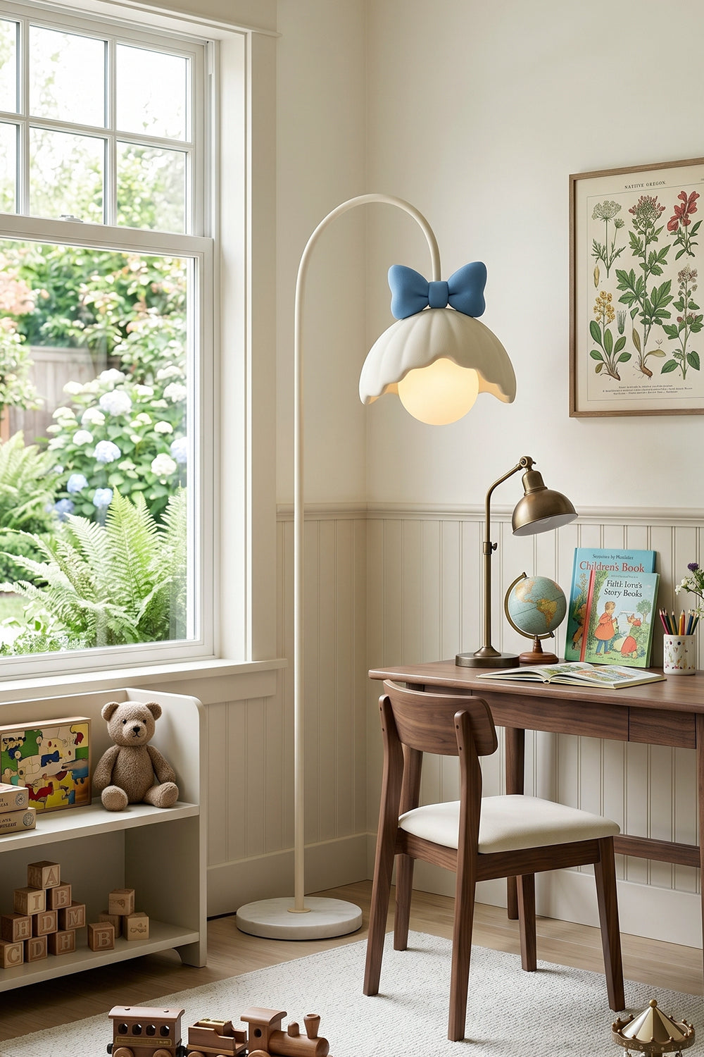 Bella Bow Arched Floor Lamp | Metal, Resin | Blue bow variant illuminating a cozy study corner next to a rustic dark wood desk and toy shelves near a window | vexa lamps