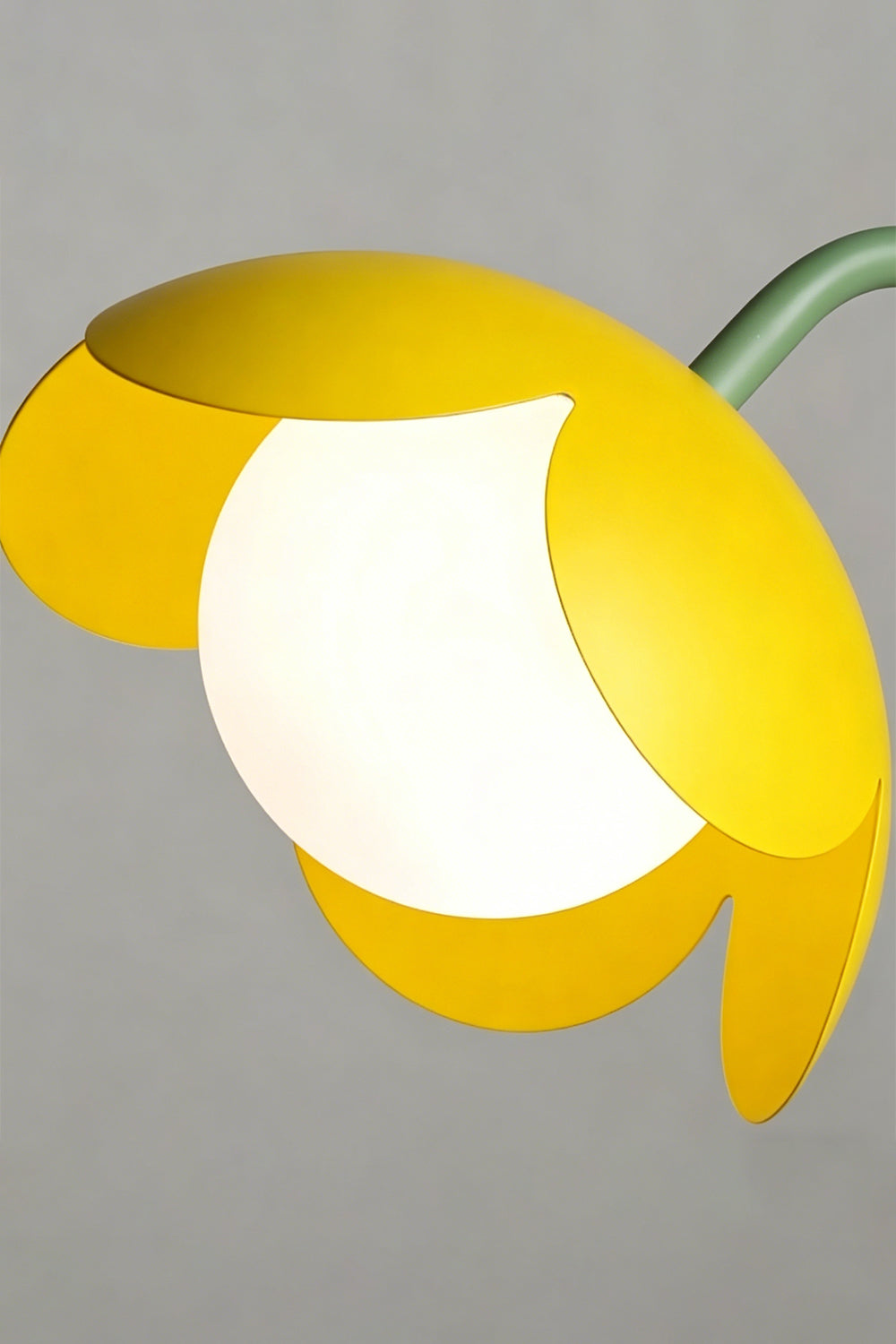 Head detail close-up | Metal and glass | Yellow petal botanical lamp | Stylized flower with stem and globe | Matte finish | vexa lamps