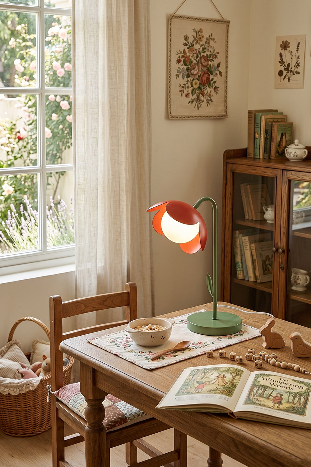 Cozy rustic living area scene | Metal and glass | Red petal botanical lamp on wooden dining table | Large window and cabinet | Floral decor | vexa lamps