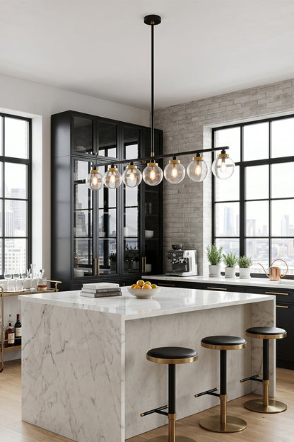 Brooks Linear Glass Globe Chandelier | Glass, Metal | Staged over a luxurious white marble waterfall kitchen island with sleek black barstools in a bright minimalist home layout | vexa lamps