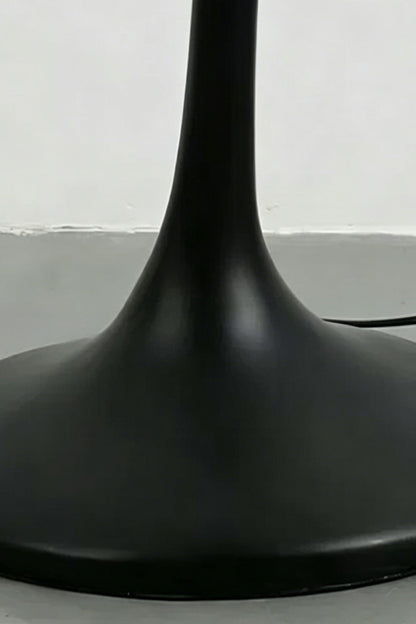 Close-up of the sleek black trumpet-style metal base | Metal