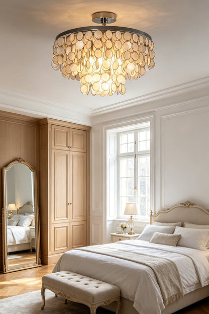 Coastal style shell ceiling lamp | Shell | Iron | Mounted in a neutral-toned bedroom above a bed | vexa lamps