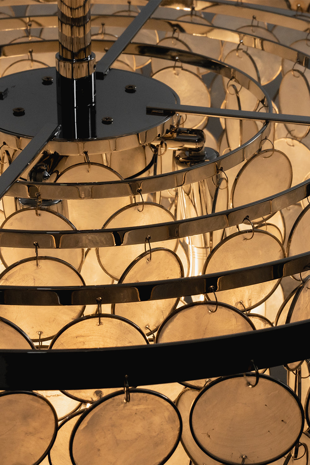 Internal chrome frame of shell ceiling light | Iron | Top-down detail of tiered rings and bulb sockets | vexa lamps
