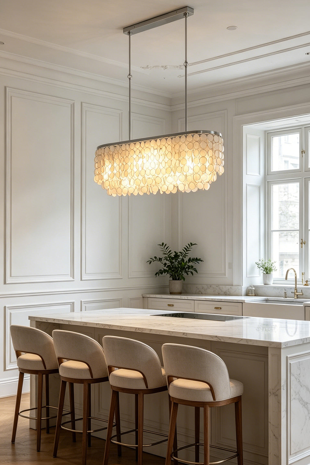 Modern linear shell chandelier | Iron | Shell | Mounted above a marble kitchen island with four high stools | vexa lamps