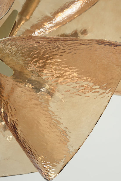 Detailed view of amber textured hammered glass petal | Glass | Showing the light-refracting surface patterns | vexa lamps