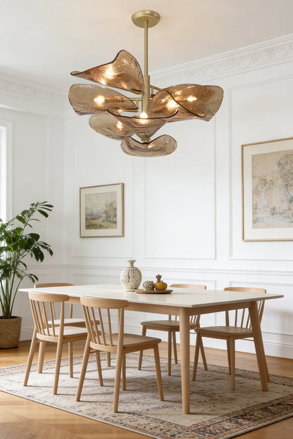 Elegant textured glass wave pendant light | Metal, Glass | Centered over a wooden dining table with chairs | vexa lamps