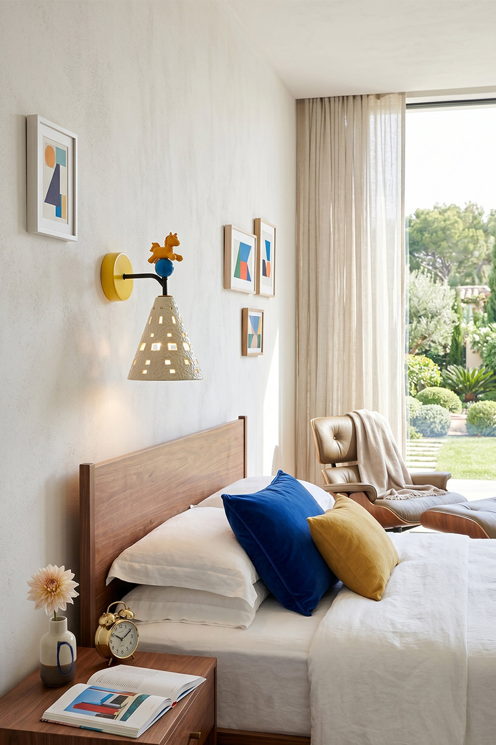 Carousel Horizon Ceramic Wall Sconce | Metal, Resin, Ceramics | Wall-mounted in a bright kid's bedroom beside a bed with vibrant blue and yellow pillows | vexa lamps Carousel Horizon