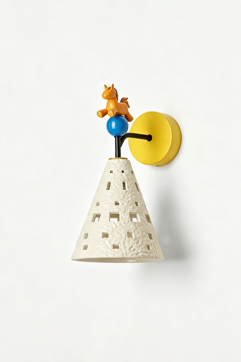 Carousel Horizon Ceramic Wall Sconce | Metal, Resin, Ceramics | Angled view of the illuminated sconce on a plain wall, highlighting its sculptural and playful form | Isolated shot | vexa lamps