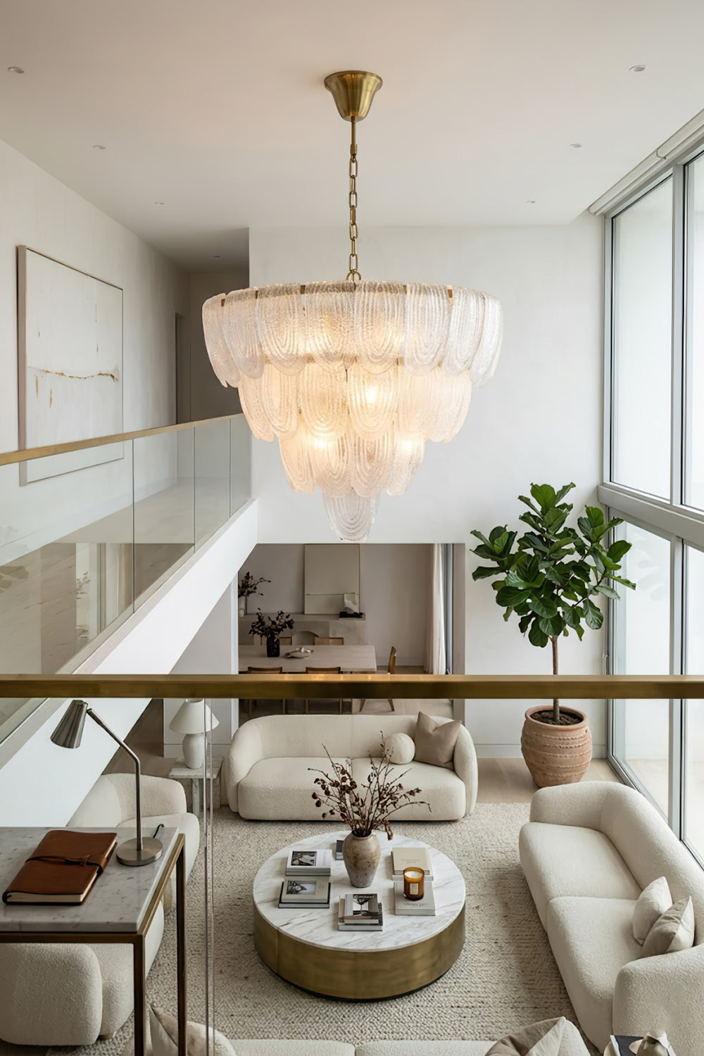 Modern cascading glass chandelier view from loft | Metal, Glass | Looking down into a bright living room with circular coffee table | vexa lamps