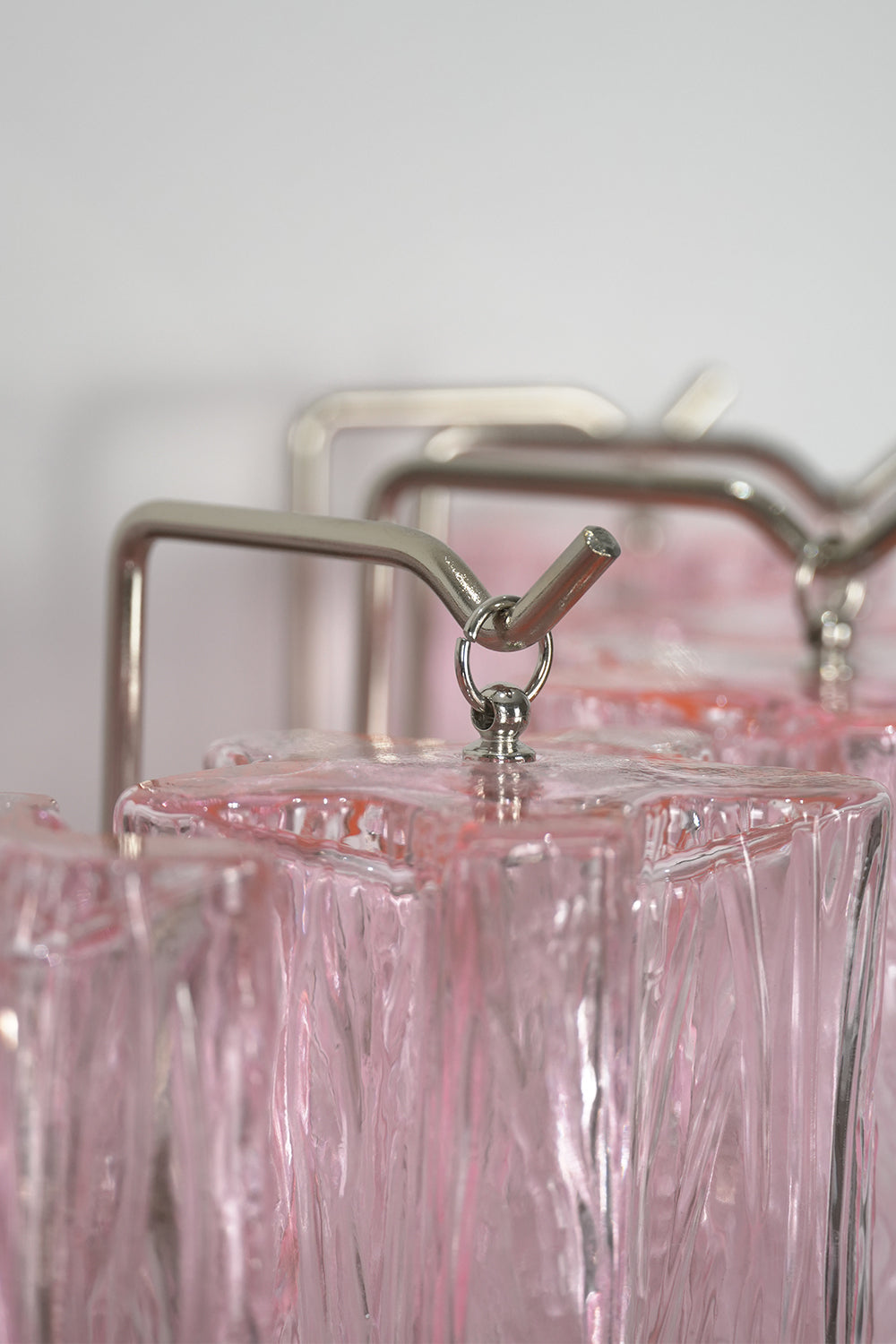 Cascading Prism Pink Glass Wall Light | Glass, Metal | Detailed shot of the metal hooks and frame supporting the glass prisms | Detail shot | vexa lamps Cascading Prism