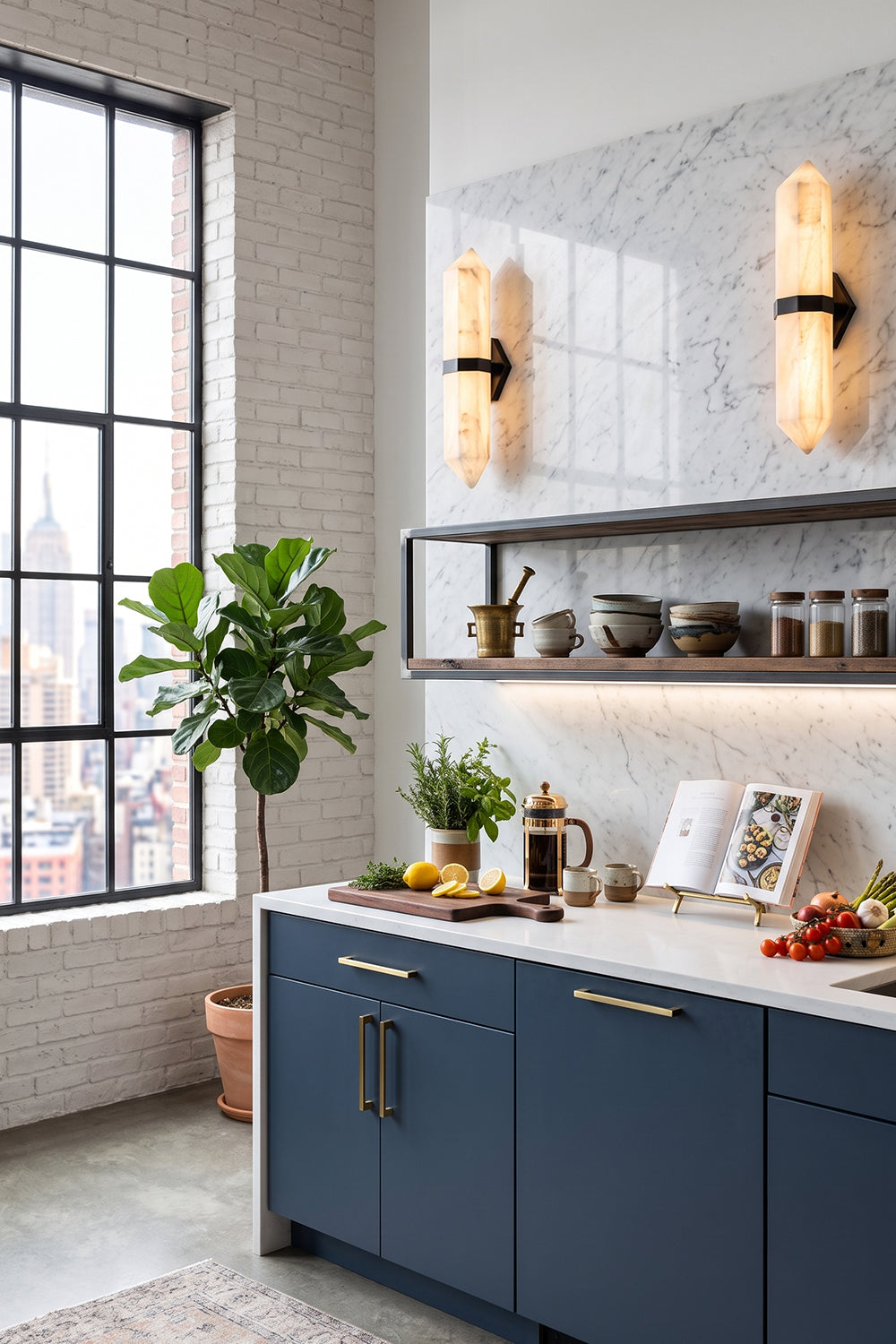 Cassian Faceted Alabaster Wall Sconce illuminating a modern kitchen design with a view.