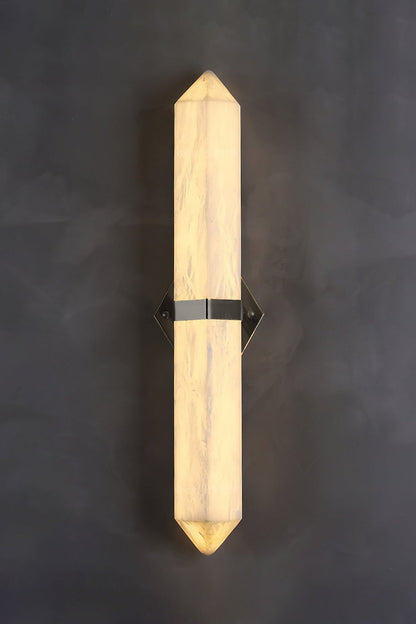 Cassian Faceted Alabaster Wall Sconce showcasing a geometric alabaster design with brass-toned bracket.
