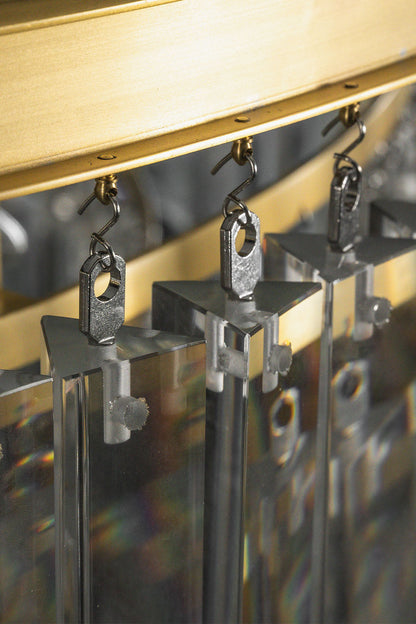Cassian Tiered Prism Ring Chandelier | Clear Prism Glass and Brass | Close-up of the metal hooks attaching clear prisms to the frame | vexa lamps