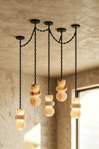 Celestial Alabaster Chandelier | Alabaster, Metal | Four-light spider configuration against beige wall | vexa lamps