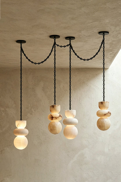 Celestial Alabaster Chandelier | Alabaster, Metal | Linear arrangement of three pendants on plain wall | vexa lamps