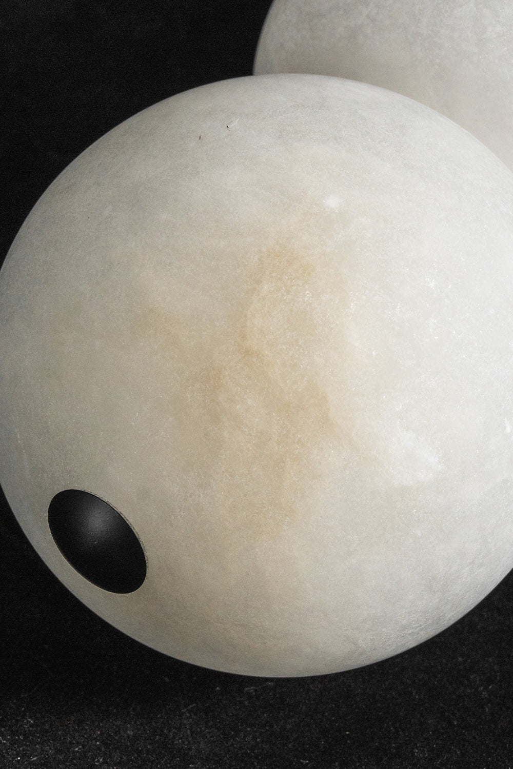 Alabaster sphere detail | Alabaster | Macro shot showing natural veining and unlit stone texture | vexa lamps