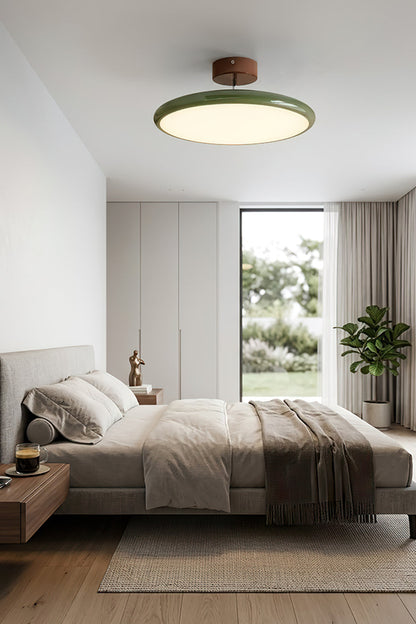 Celestial Disc Lacquered Ceiling Light | Acrylic, Metal | A broader view of the modern bedroom from Image 2, looking towards the large windows with the illuminated ceiling light against a serene background | vexa lampsCelestial Disc