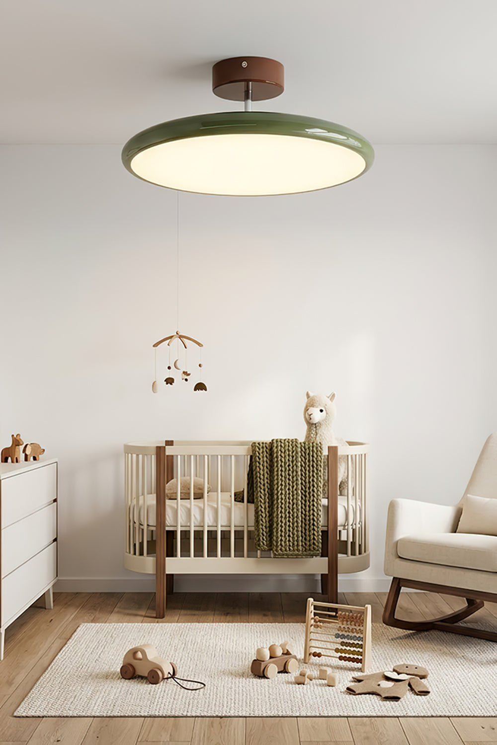 Celestial Disc Lacquered Ceiling Light | Acrylic, Metal | Green lacquered trim variant installed and illuminated in a bright, tranquil nursery with a crib and rocking chair | vexa lampsCelestial Disc