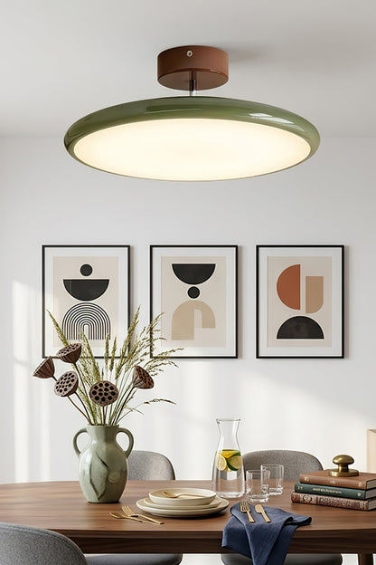 Celestial Disc Lacquered Ceiling Light | Acrylic, Metal | Beige lacquered trim variant installed and illuminated in a clean, contemporary kitchen with white cabinets and stainless steel appliances | vexa lampsCelestial Disc