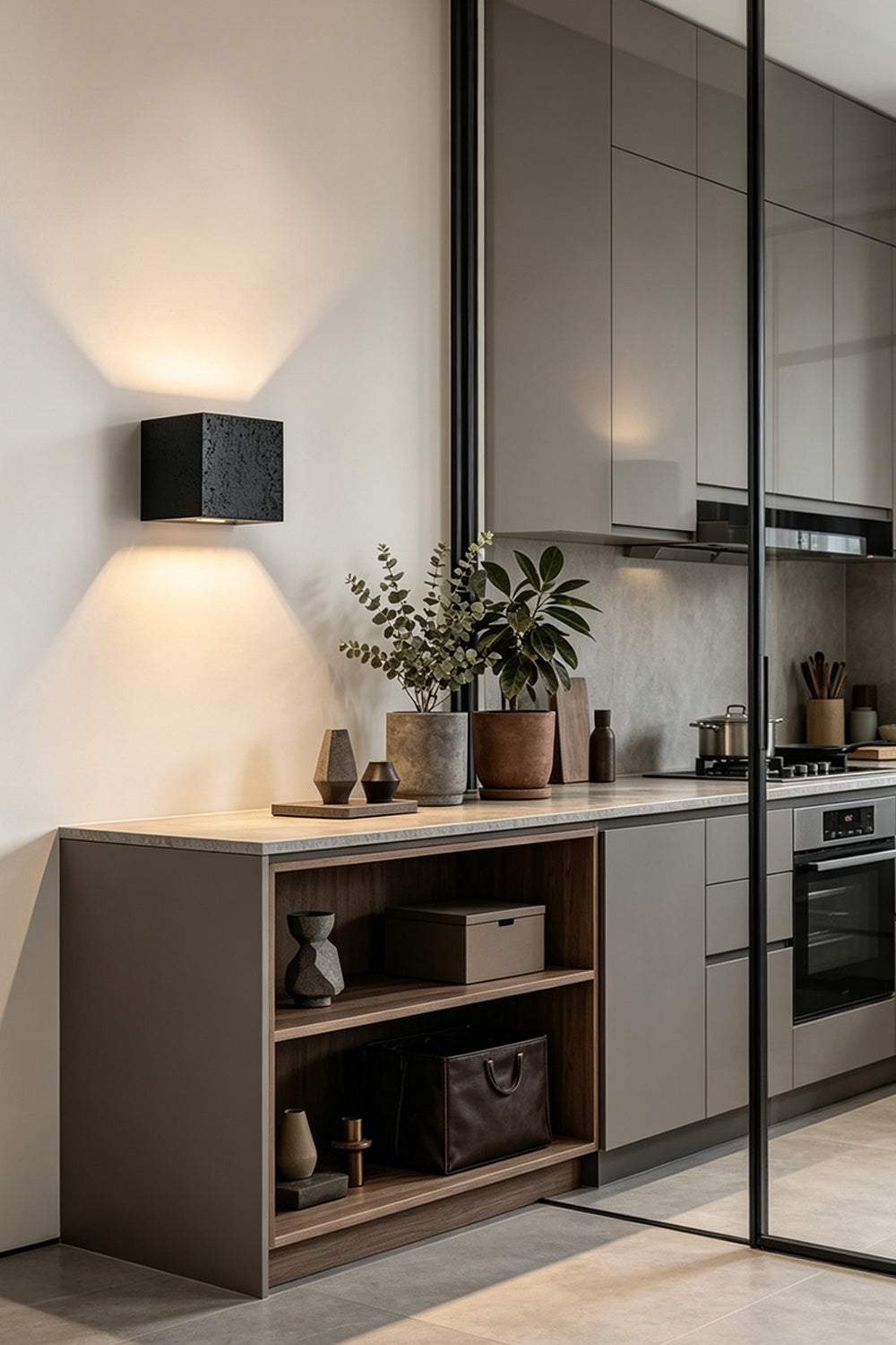 Celestial Tectonic Black Travertine Wall Lamp | Black Travertine | Accent lighting above a minimalist kitchen counter | vexa lamps