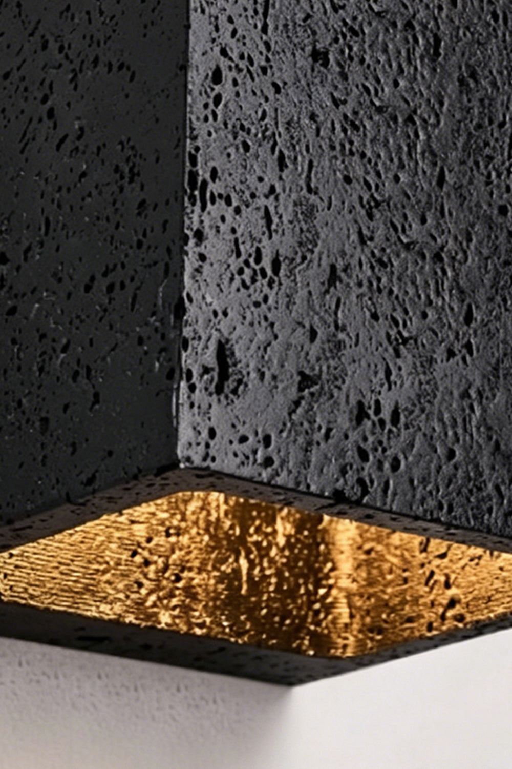 Celestial Tectonic Detail | Black Travertine, Gold Foil | Close-up of porous stone texture and golden lining | vexa lamps