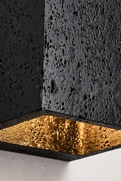 Celestial Tectonic Detail | Black Travertine, Gold Foil | Close-up of porous stone texture and golden lining | vexa lamps