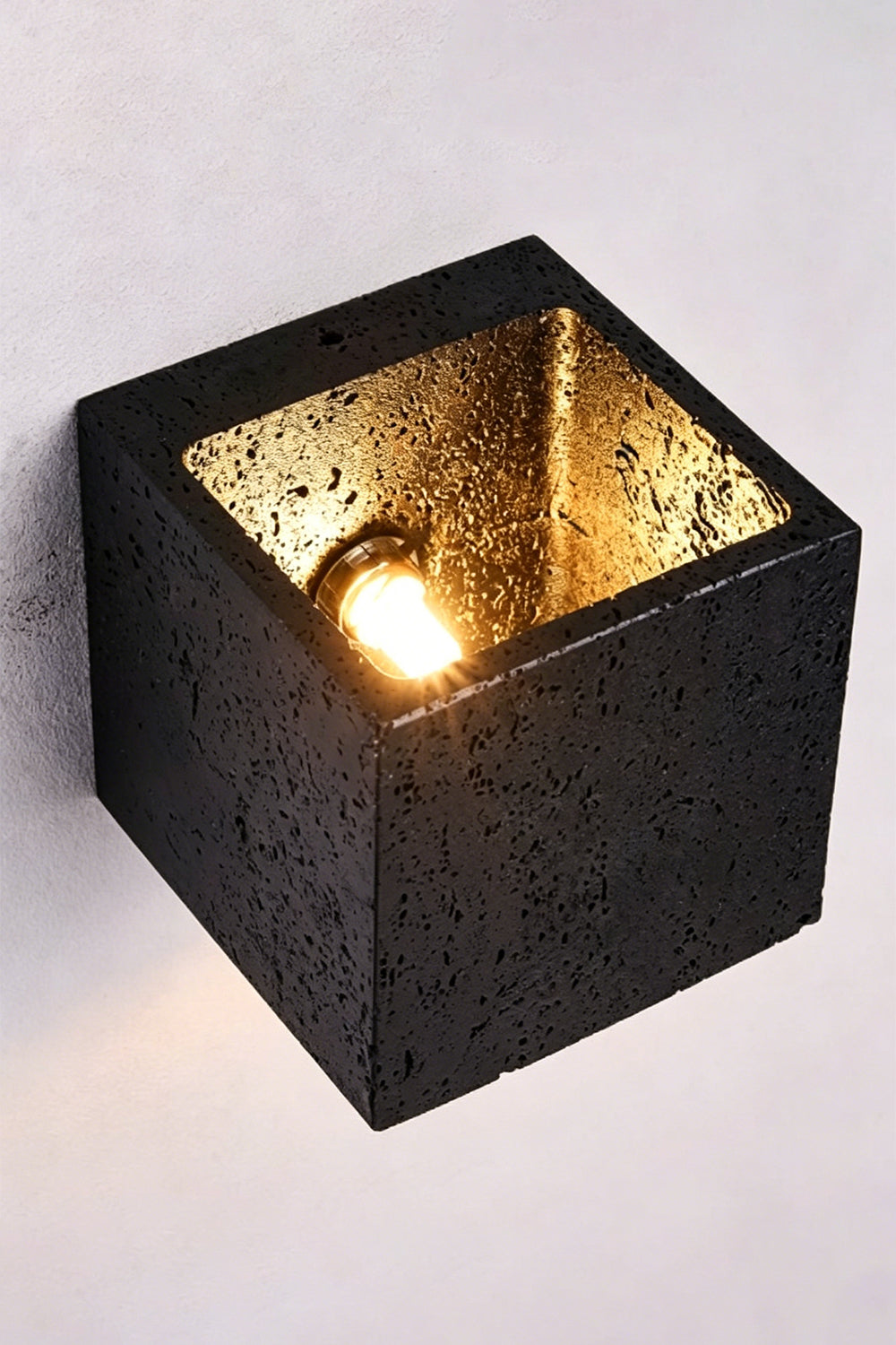 Celestial Tectonic Internal View | Black Travertine | Top-down view of internal bulb and textured gold lining | vexa lamps