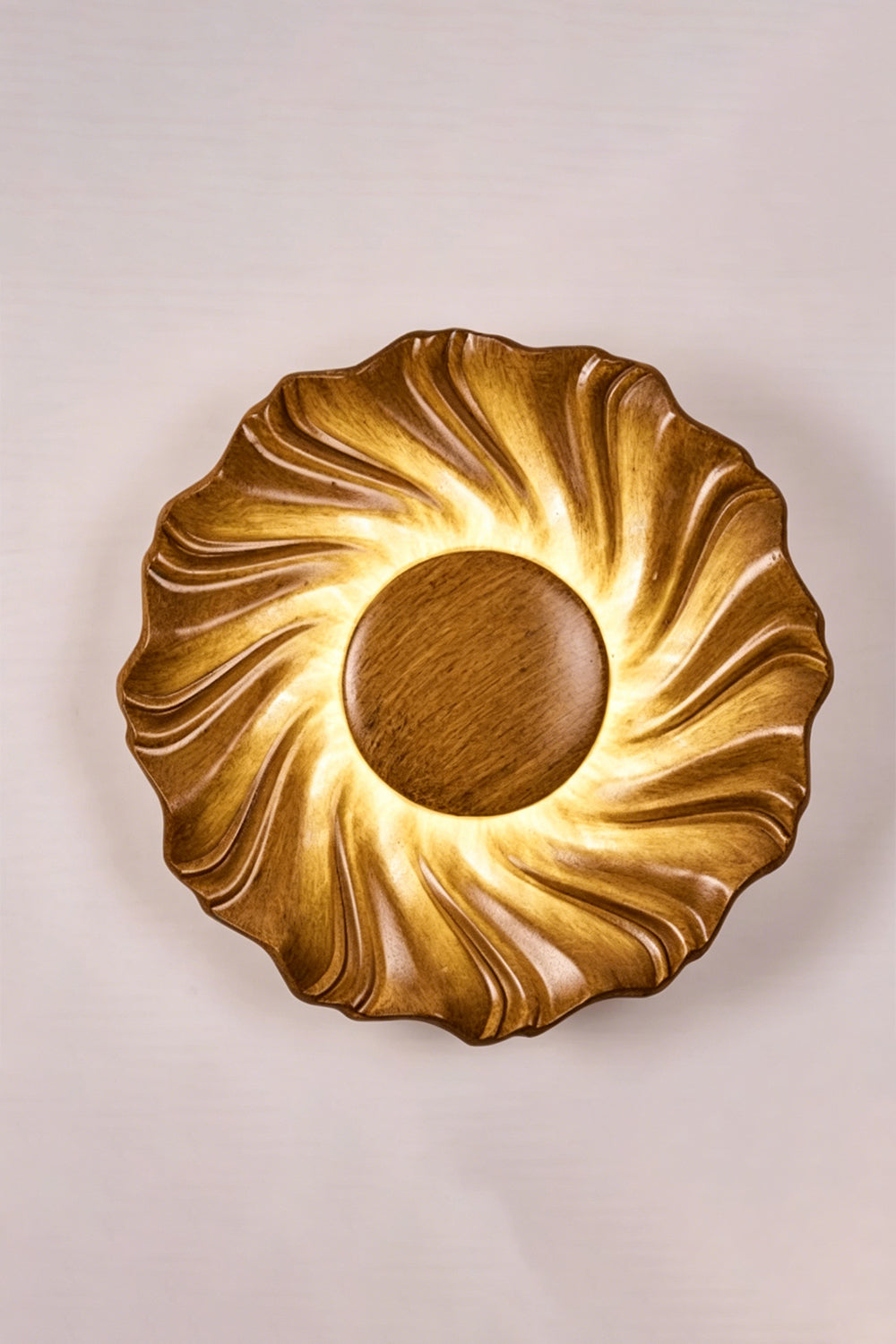 Centripetal Solstice Metal Wall Lamp | Metal, Resin | Wood grain textured lamp on a plain background, providing warm light | Isolated lit variant shot | vexa lamps