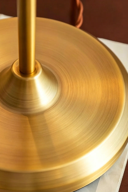 Clara Vintage Pastel Glass Table Lamp | Glass, Metal | Close-up macro focus on the circular brushed brass metal base plate and stem | Detail shot | vexa lamps