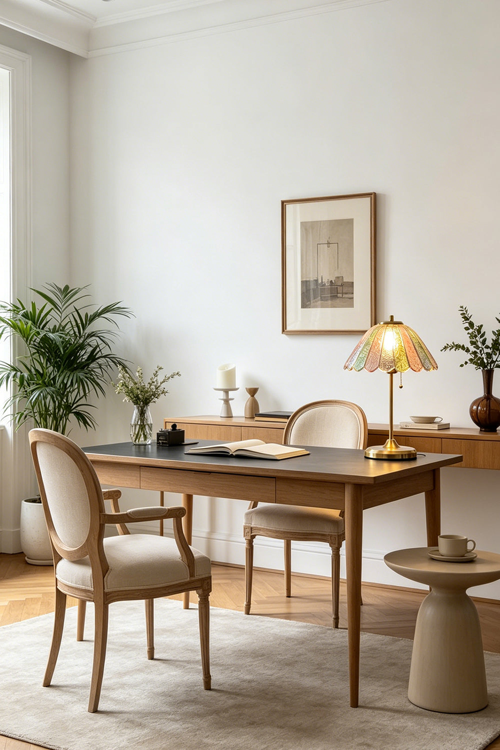 Clara Vintage Pastel Glass Table Lamp | Glass, Metal | Illumination on a minimalist wooden writing desk next to green indoor potted plants | vexa lamps