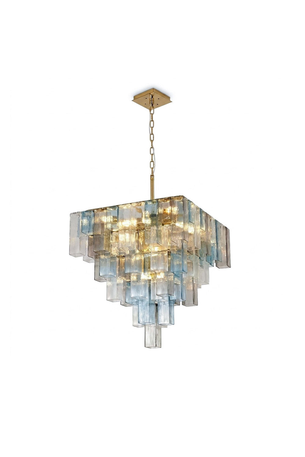 Clarissa Tiered Square Glass Chandelier | Textured Glass, Brass | Isolated lit view of a luxury multi-tiered square chandelier featuring rows of staggered blue, clear, and tinted textured glass panels on a gold brass frame | White background | vexa lamps
