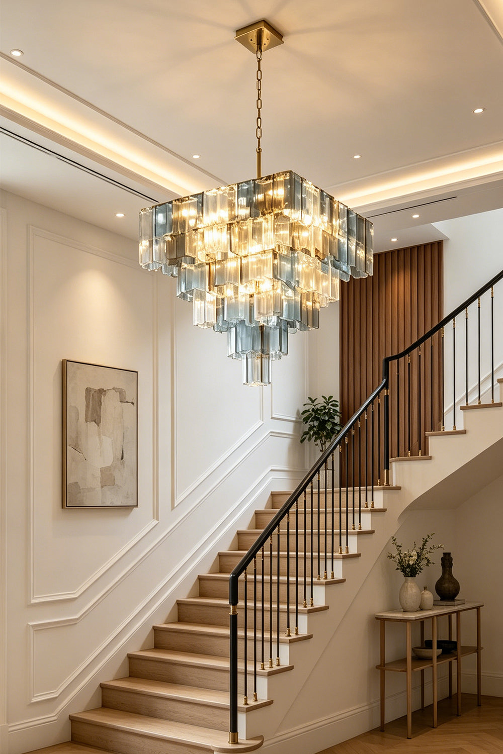 Clarissa Tiered Square Glass Chandelier | Entryway Foyer Lamp | Staged as a grand focal point ceiling light fixture in an upscale hallway right next to an elegant wooden staircase | vexa lamps