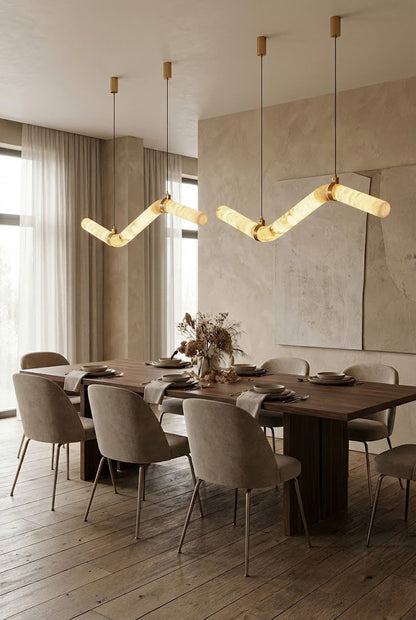 Pair of undulating alabaster tube chandeliers | Alabaster, Brass | Symmetrical installation in a neutral-toned dining room | vexa lamps