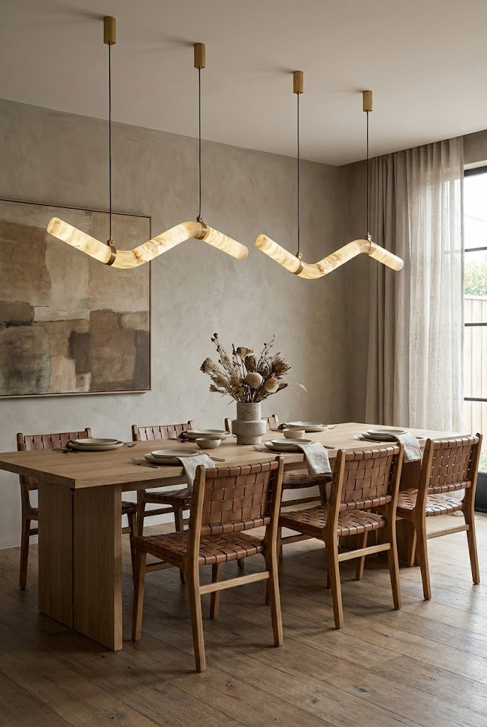 Contemporary alabaster pendant over a set dining table | Alabaster, Brass | Interior scene with neutral walls and classic decor | vexa lamps