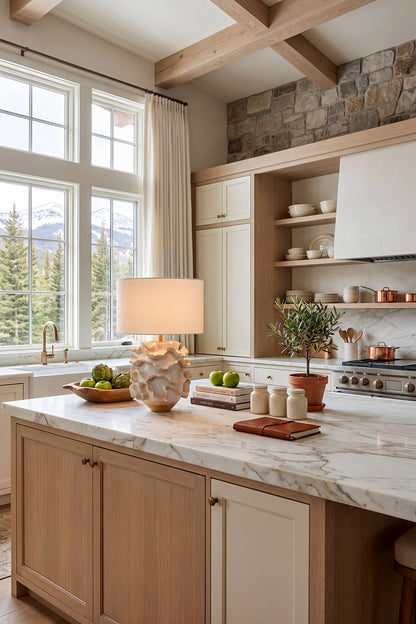 Coralia Ruffled Ceramic Table Lamp illuminating a modern kitchen with natural light and elegant decor.