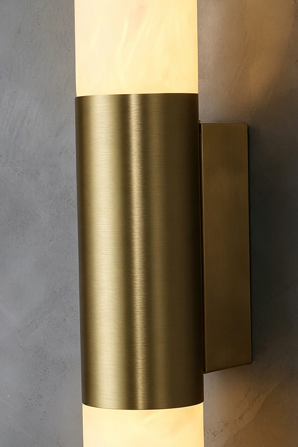 Corin Linear Alabaster Wall Sconce with a sleek gold-toned frame and glowing alabaster tube.