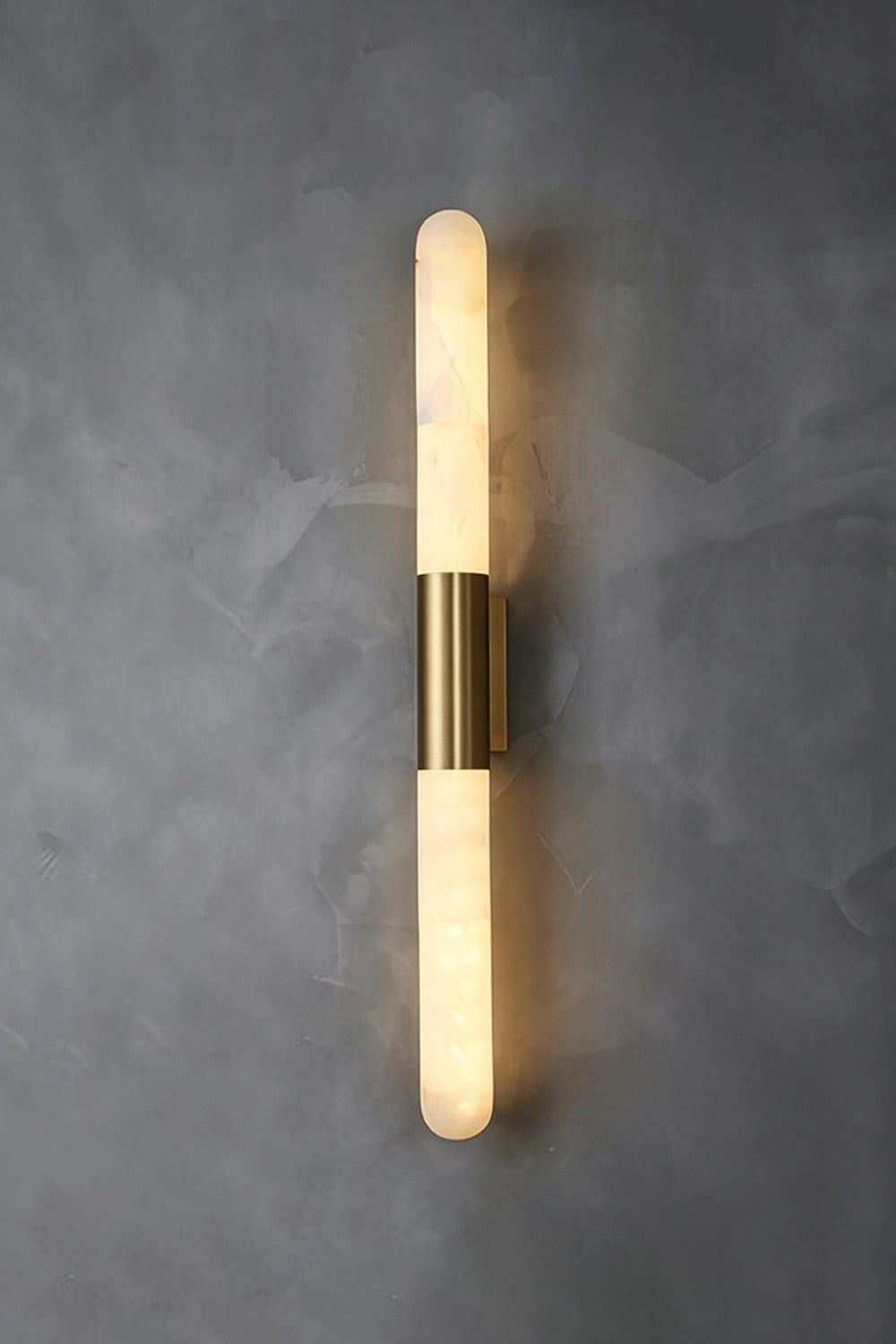 Corin Linear Alabaster Wall Sconce with warm light illuminating through natural alabaster.