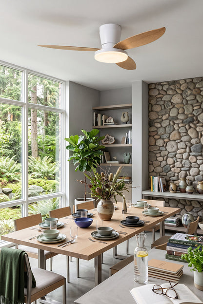 Corin Low-Profile Ceiling Fan Light illuminating a modern dining space with wooden blades and stylish decor.